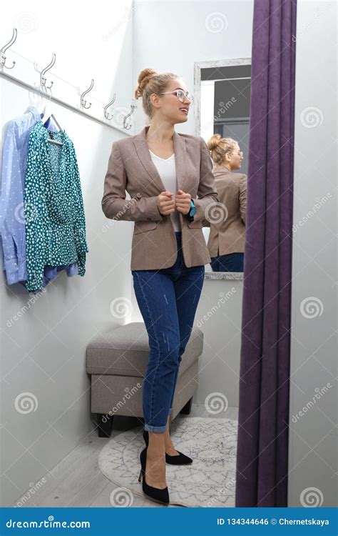 dressing room flashing|Young Woman Trying On Clothes In Dressing Room And。